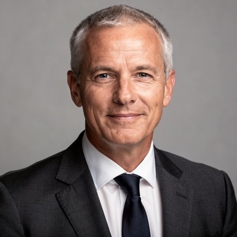 Studio portrait of an older man in formal business attire