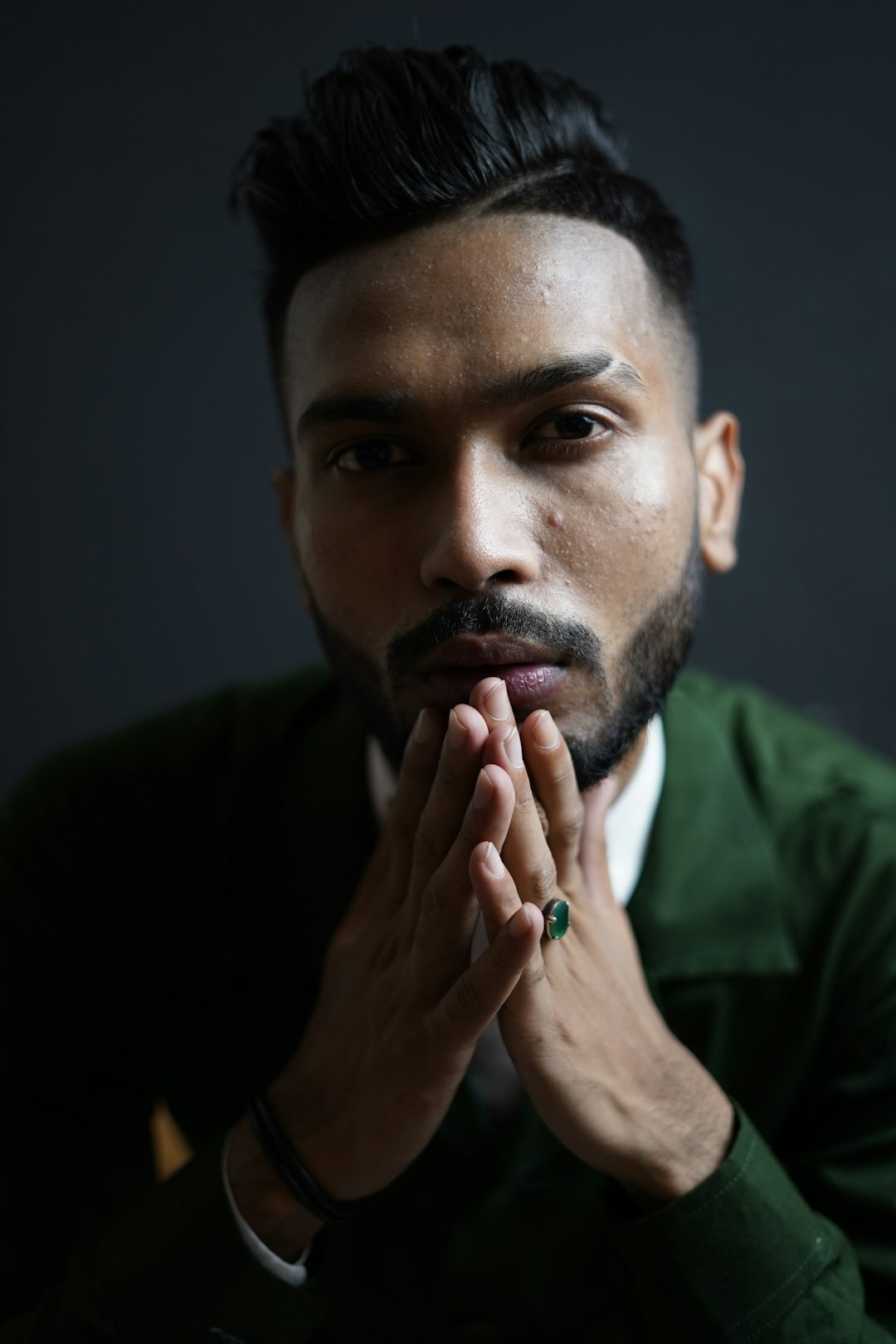 Studio portrait of a man with a beard in business casual attire