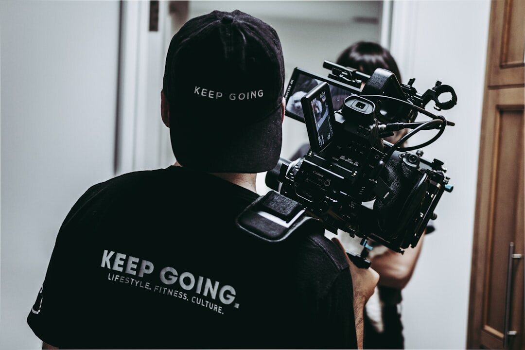 Television production crew filming with camera and lighting rig